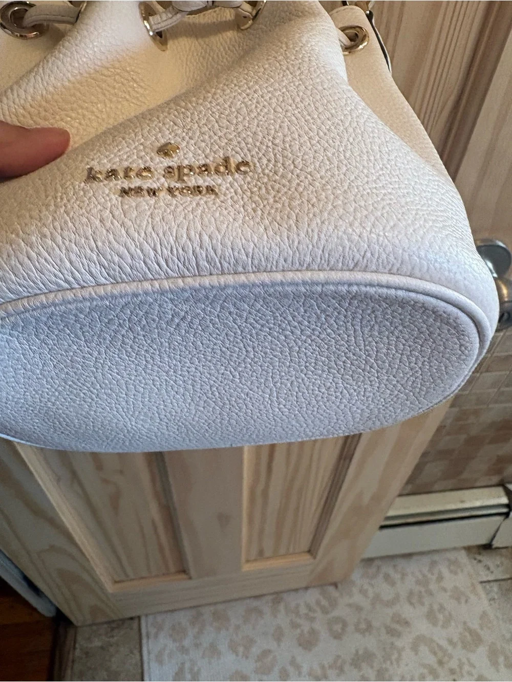 kate spade Cream Pebbled Leather Drawstring Crossbody with Striped Strap